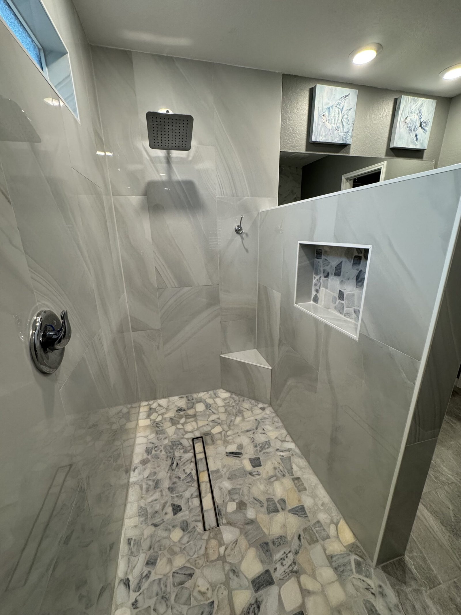 Custom tiled walk-in shower installed during a luxury bathroom remodel by Bath By Design SA in San Antonio, Texas.